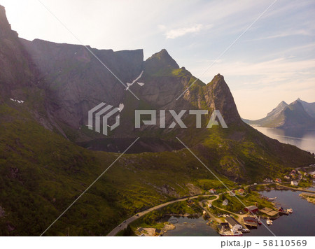 Mountain lake and Reine village, Lofoten islands Mountain lake and Reine village, Lofoten islands 58110569