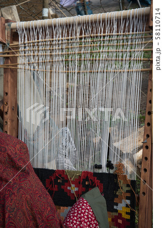 woman at work, carpet production, handmade.manufacture of carpet 58110714