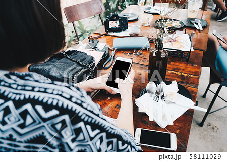 Business asian women cozy dress use cellphone in 58111029