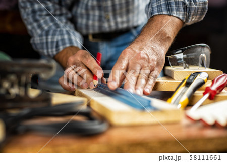 Craftsman at work on wooden boards. Carpentry. Craftsman at work on wooden boards. Carpentry. 58111661