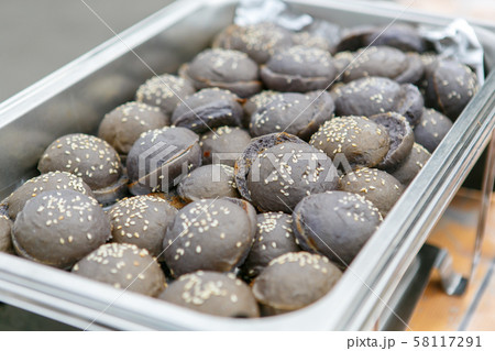 A closeup view of exotic black colored mini hamburger buns A closeup view of exotic black colored mini hamburger buns 58117291