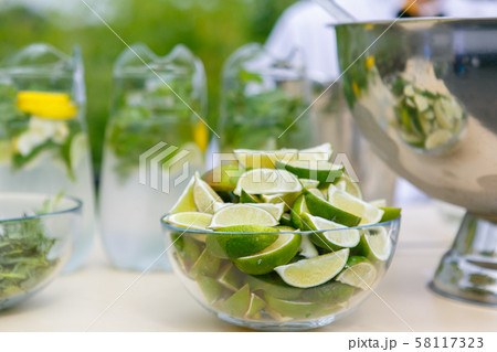 A close up of glass bowl with pieces of the lime in it A close up of glass bowl with pieces of the lime in it 58117323