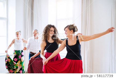 Group of senior people in dancing class with dance teacher. 58117739