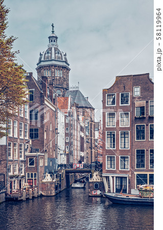 Amsterdam canal with old houses 58119964