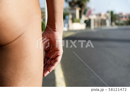 naturist man naked on the street 58121472
