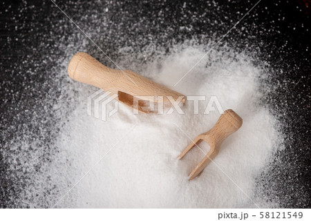 Top view of two scoops with baking soda on wood Top view of two scoops with baking soda on wood 58121549