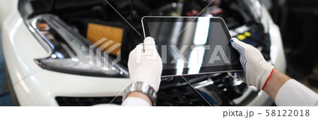 Male hand in white protective gloves hold digital 58122018