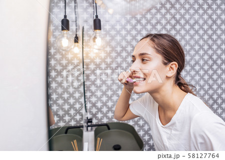 Beautiful woman taking care of her teeth 58127764