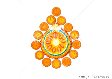 Happy Diwali - Clay Diya lamps lit during Happy Diwali - Clay Diya lamps lit during 58129015