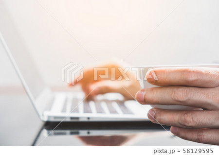 businessman working on laptop for project and enjoying coffee in the morning businessman working on laptop for project and enjoying coffee in the morning 58129595