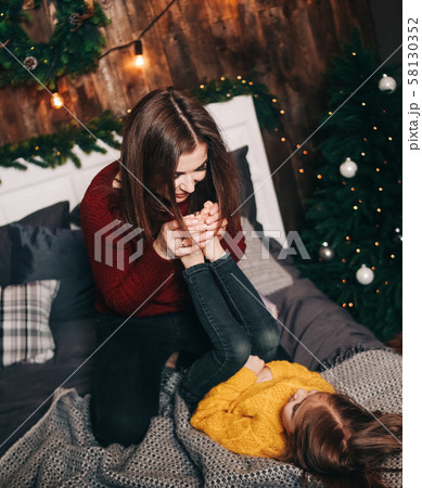 mom daughter indulge fun inside Christmas 58130352