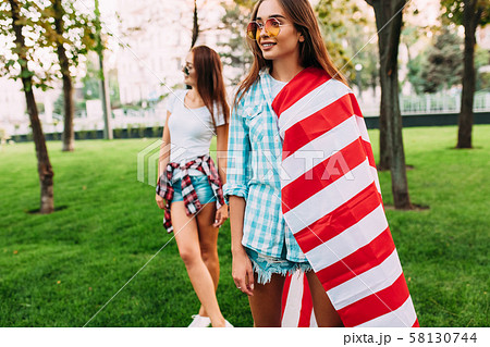 Two stylish attractive girls with an American Two stylish attractive girls with an American 58130744
