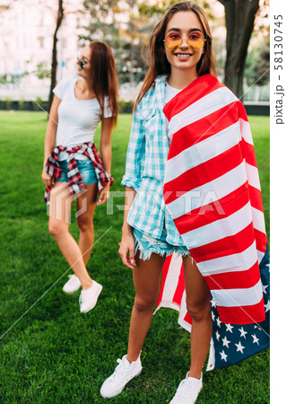 Two stylish attractive girls with an American Two stylish attractive girls with an American 58130745