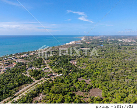 Aerial view of Praia Do Forte coastline town with 58137902
