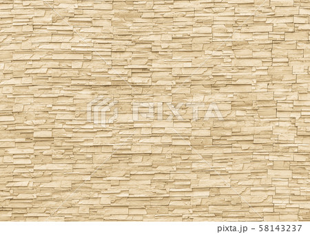 Rock stone brick tile wall aged texture detailed pattern background in yellow cream beige color 58143237