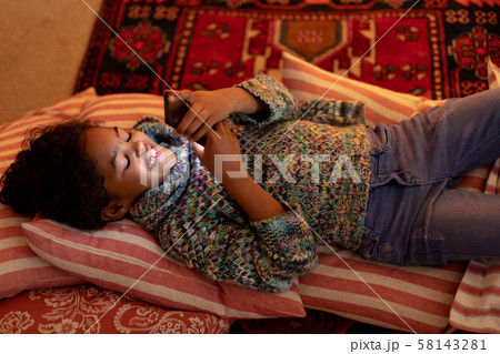 Girl at home at Christmas time Girl at home at Christmas time 58143281