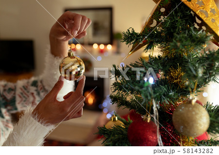Woman at home at Christmas time 58143282