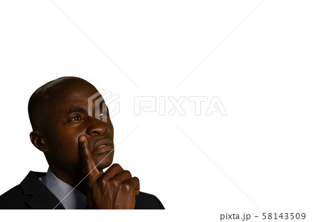 Businessman thinking and looking up 58143509