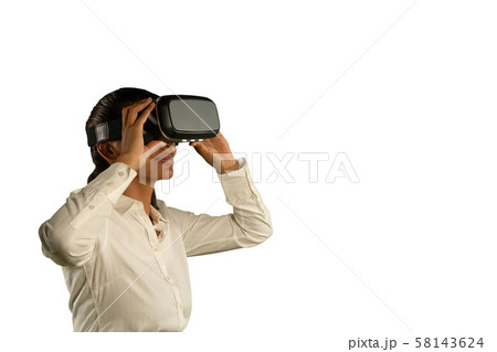 Young businesswoman using a VR headset 58143624