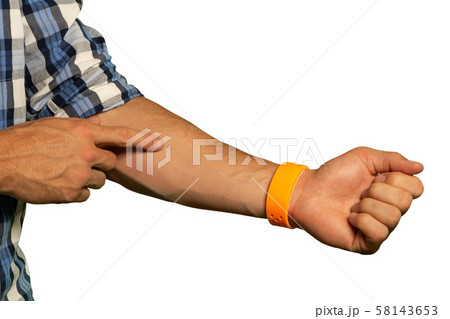 Man pointing to his arm 58143653