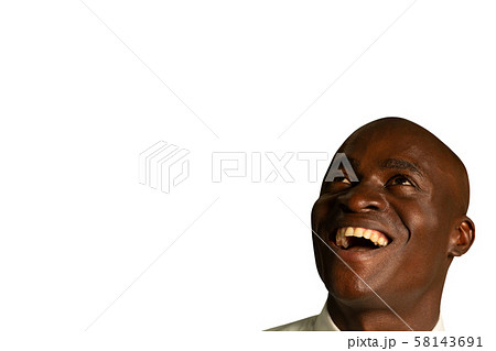 Happy young businessman looking up 58143691