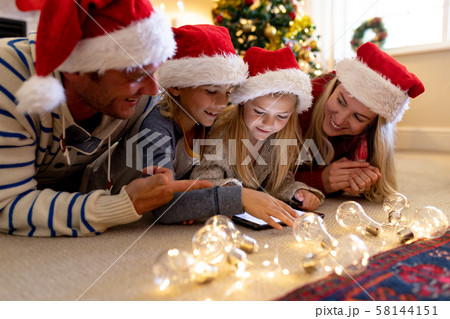 Family at home at Christmas time 58144151
