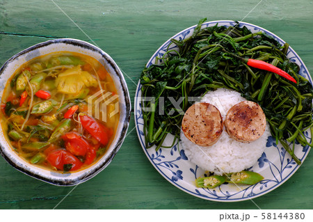 vegetarian meal, rice dish with boiled water morning glory, vegan sausage, sour soup bowl vegetarian meal, rice dish with boiled water morning glory, vegan sausage, sour soup bowl 58144380