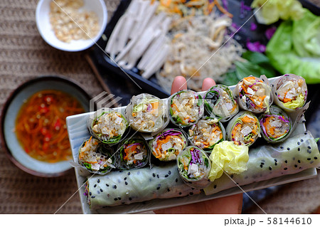sliced vegan rice paper rolls on spring roll ingredient background 58144610