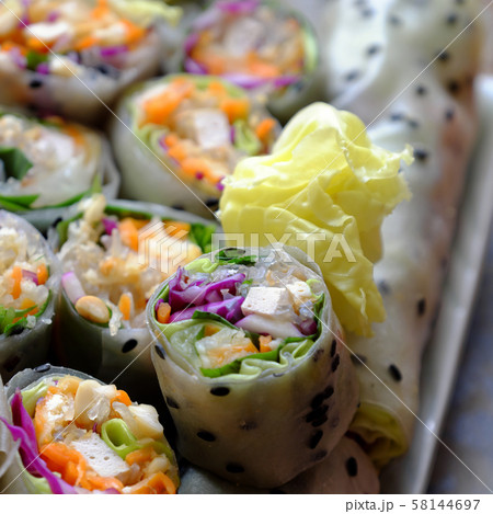 sliced vegan rice paper rolls and Vietnamese spring roll ingredient sliced vegan rice paper rolls and Vietnamese spring roll ingredient 58144697