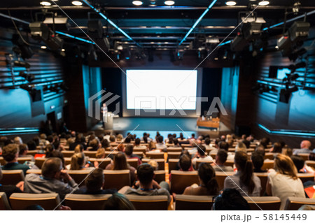 DEFOCUSED image of speaker giving a talk in conference hall at business event. DEFOCUSED image of speaker giving a talk in conference hall at business event. 58145449