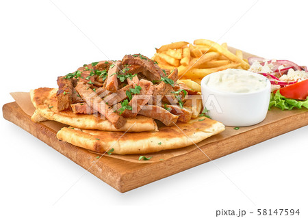 traditional Greek dish called Gyros pita and fries traditional Greek dish called Gyros pita and fries 58147594