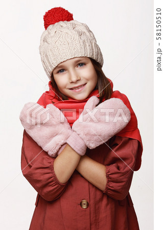 The recovering laughing girl in a jacket, a cap, 58150510