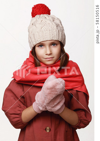 The recovering laughing girl in a jacket, a cap, 58150516