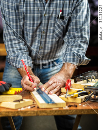 Craftsman at work on wooden boards. Carpentry. Craftsman at work on wooden boards. Carpentry. 58151222