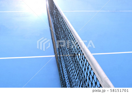 net of tennis court with white border line on blue floor 58151701