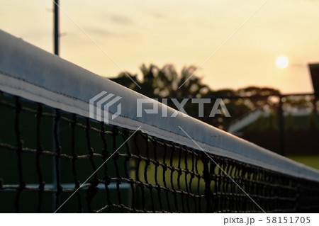 net of tennis court with white border line on blue floor 58151705