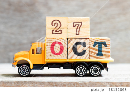 Truck hold letter block in word oct on wood background  58152063