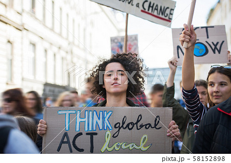 People with placards and posters on global strike for climate change. 58152898
