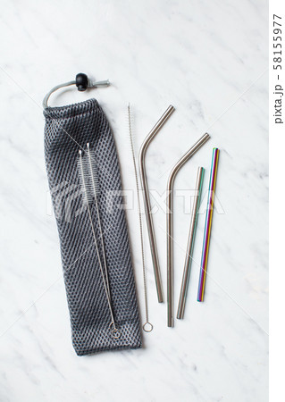 Top view of metal drinking straws on white marble Top view of metal drinking straws on white marble 58155977