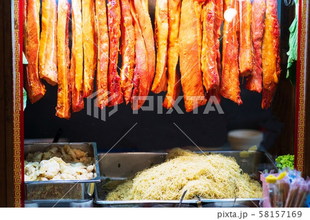 red roast BBQ pork hanging front of Noodle shop 58157169