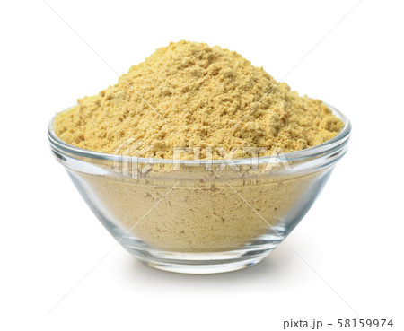 Glass bowl of mustard powder 58159974