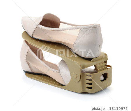 Pair of shoes on plastic storage shoes rack holder Pair of shoes on plastic storage shoes rack holder 58159975