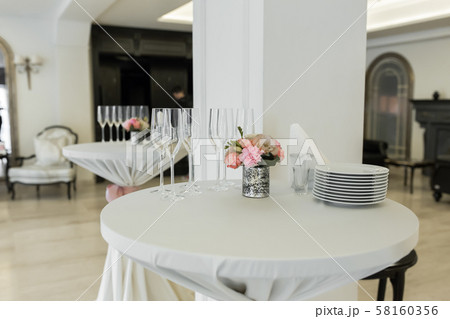 A small auxiliary table in the restaurant, on 58160356