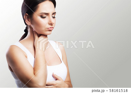Sore throat. Sick woman, flu Young beautiful woman with sore throat. Feeling painful in the throat Sore throat. Sick woman, flu Young beautiful woman with sore throat. Feeling painful in the throat 58161518