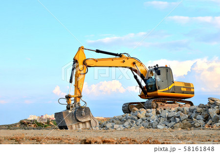 Excavator with crusher bucket for crushing concrete.  58161848