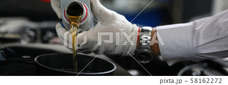 Male hand in white protective gloves with funnel Male hand in white protective gloves with funnel 58162272
