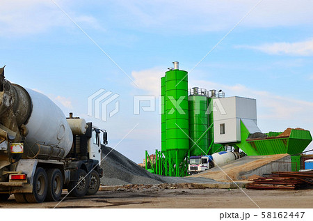 Concrete batching plant. Industrial producing concrete for construction. Heavy mixer concrete truck 58162447