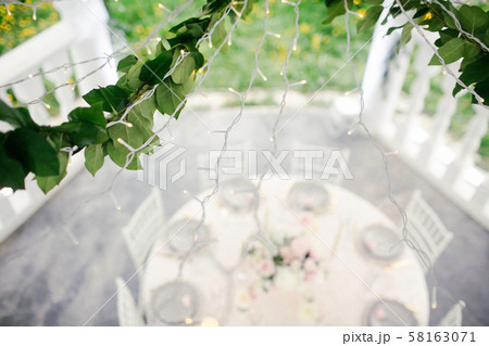 Amazing wedding table decoration with flowers on wooden tables for wedding dinner 58163071