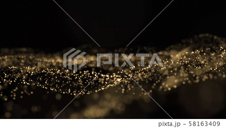 Gold glitter light particles splash wave, golden glittering glow sparks with bokeh on black 58163409