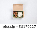 Sticky rice with fried pork put in a brown paper box, put on a white tablecloth 58170227